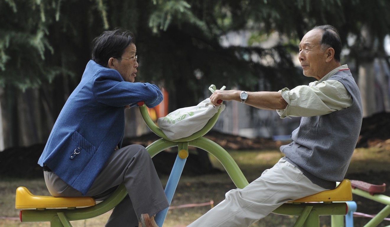 An elderly Chinese couple chat while sitting on exercise machines at a park in Shanghai. By 2040 the average Chinese person will live 81.9 years. Photo: AFP