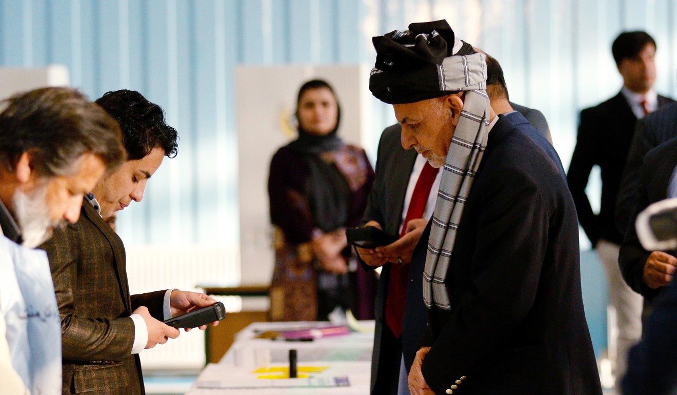 Afghan President Ashraf Ghani casts his vote in parliamentary elections on Saturday. Photo: EPA