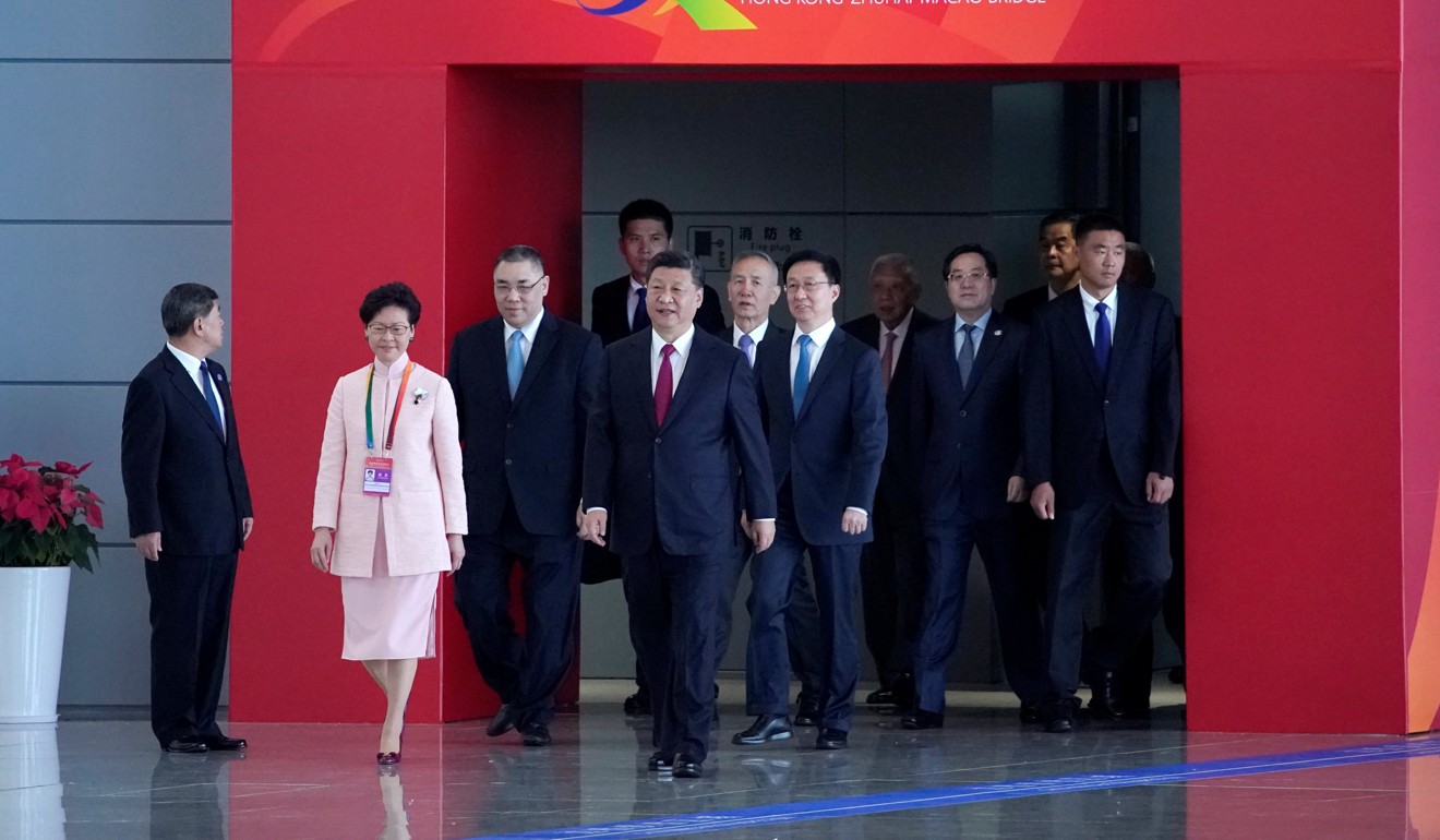 President Xi Jinping and Hong Kong Chief Executive Carrie Lam enter the hall for the opening ceremony of the Hong Kong-Zhuhai-Macau Bridge. Photo: Reuters