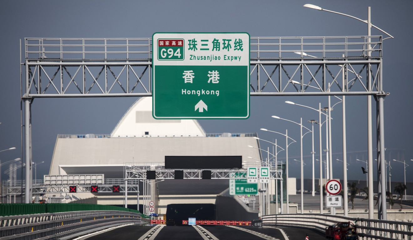 A sign directing traffic to Hong Kong on the Hong Kong-Zhuhai-Macau Bridge, which opened on Wednesday, October 24. Photo: Bloomberg