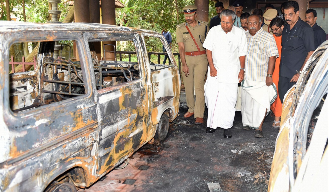 Kerala chief minister Pinarayi Vijayan (second from right) and his entourage assesses the damage after an attack on a spiritual retreat in Kundamankadavu on the outskirts of Thiruvananthapuram in southern Kerala state on October 27, 2018. Photo: AFP
