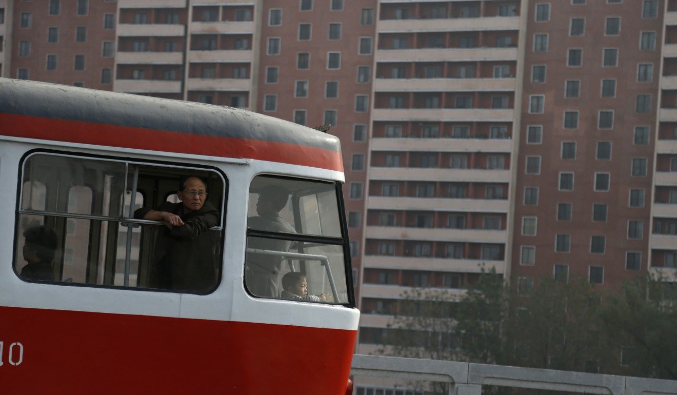 A man looks out from a Pyongyang tram. South Korea’s US$1.5 trillion economy is estimated to be 40 to 50 times larger than that of the North. Photo: AP