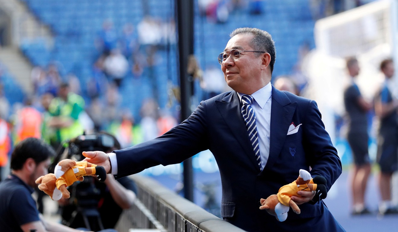 Leicester City chairman Vichai Srivaddhanaprabha hands out toys during the lap of honour at the end of the 2017-18 season. Photo: Reuters
