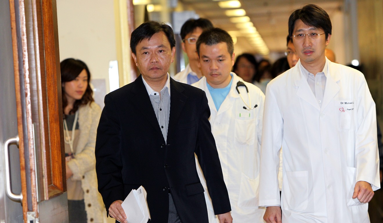 Hospital Authority chief executive, Dr Leung Pak-yin (in dark suit), prepares to meet the media at Tuen Mun Hospital in 2011. Photo: Dickson Lee