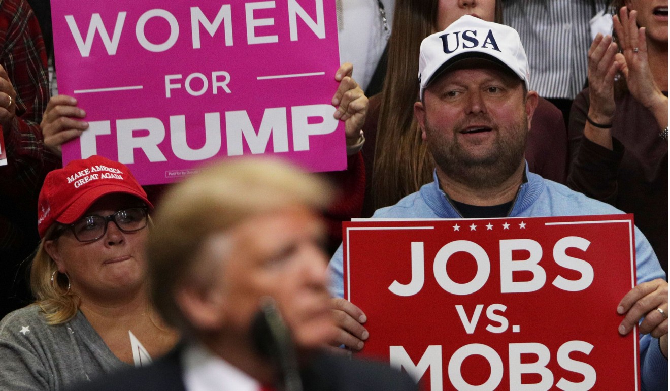Trump supporters holding signs at the rally in Chattanooga. Photo: AFP