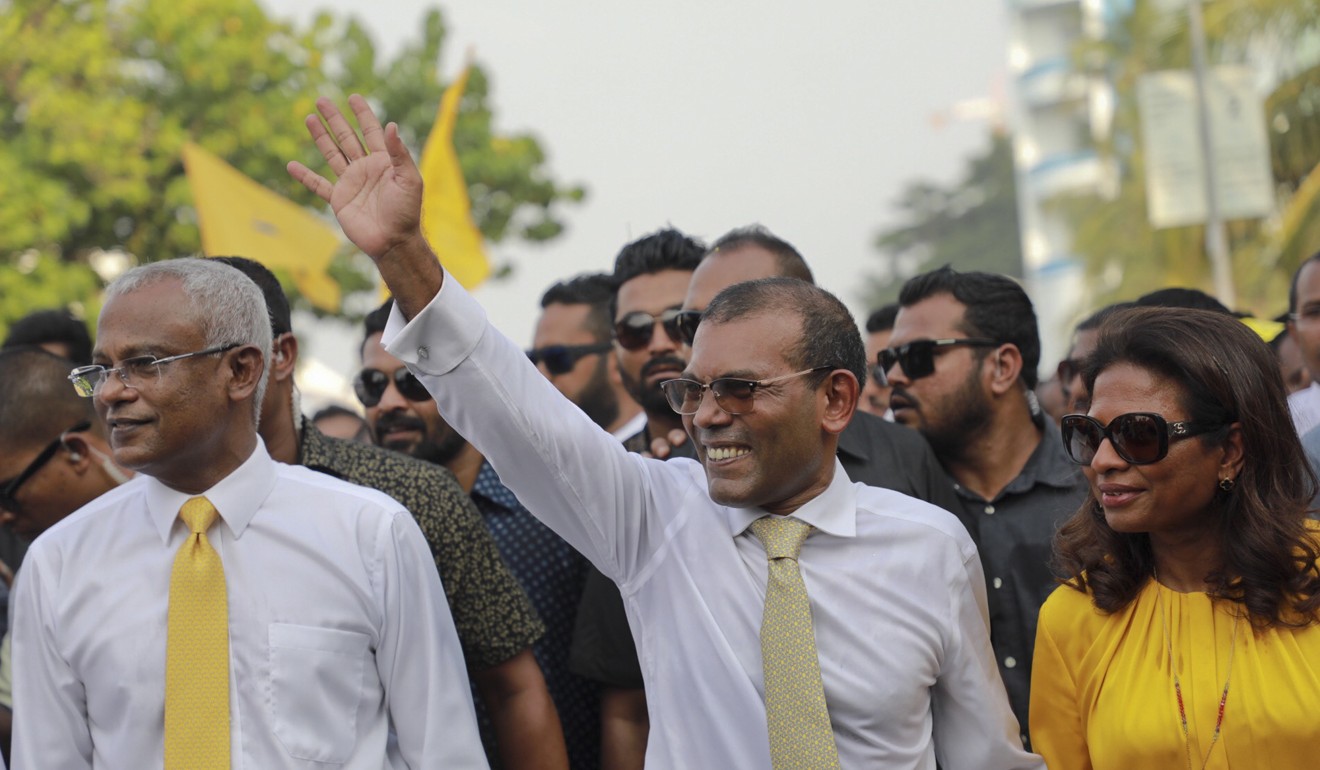Former president Mohamed Nasheed, with Solih on his right. Photo: AP