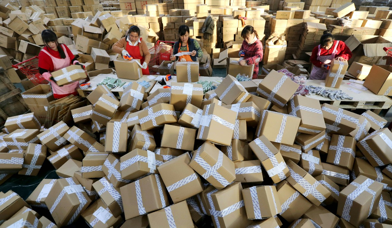 Workers prepare packages for delivery at a sorting centre in China’s Jiangsu province during Singles’ Day in 2016. Photo: AFP