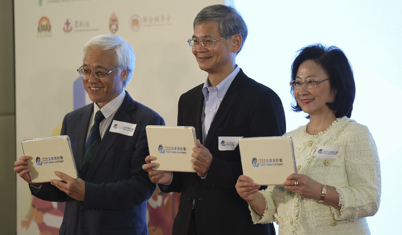 Labour and welfare minister Dr Law Chi-Kwong (centre); Professor Paul Tam Kwong-hang (left), acting president of HKU; and Hong Kong Jockey Club steward Leung Ko May-yee at the launch of the Smart Family-Link Project on Sunday. Photo: K.Y. Cheng