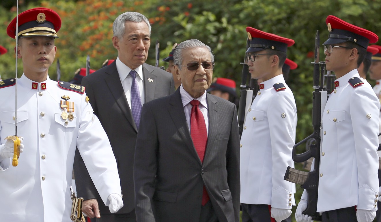 Prime Minister Mahathir Mohamad (centre) wants to recover US$4.5 billion in total. Photo: AP