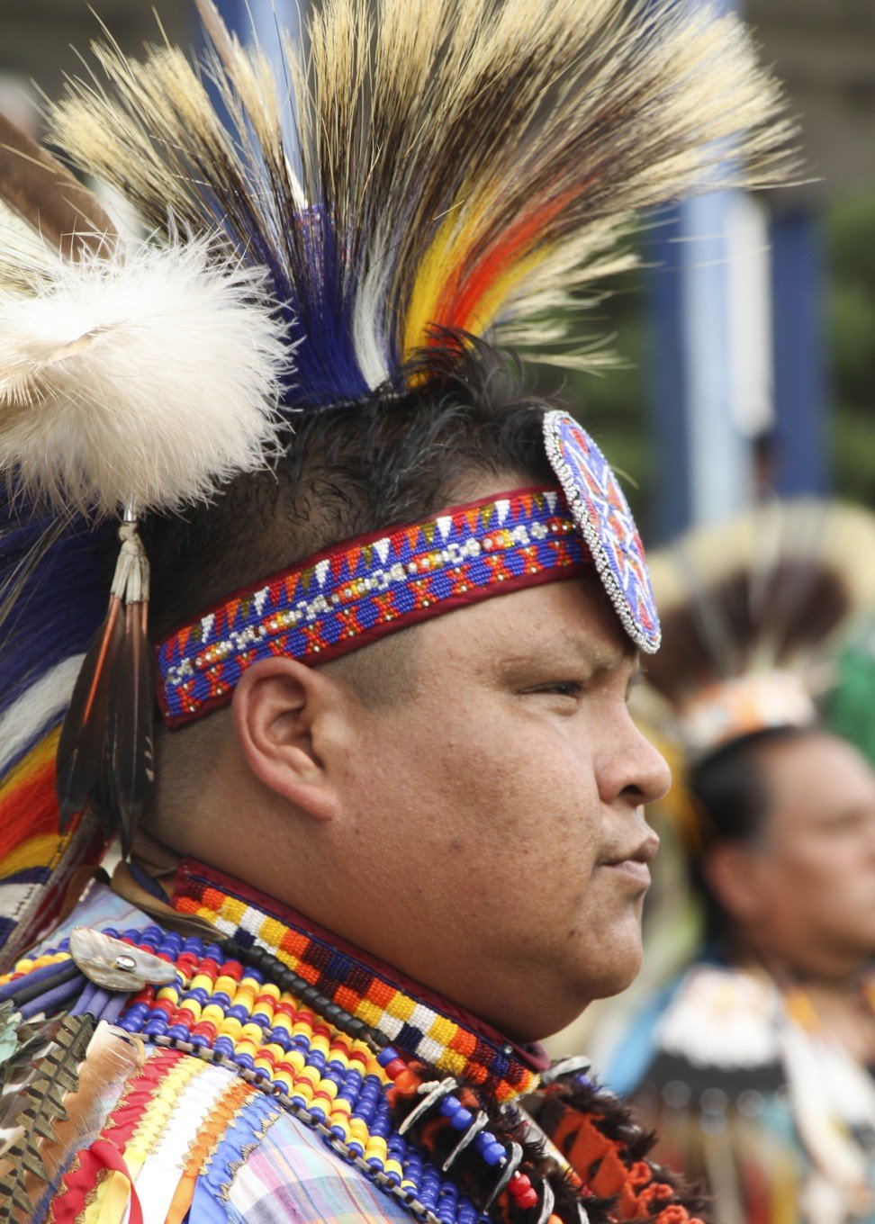 A member of the Ho-Chunk wears his tribal regalia at the pow wow.