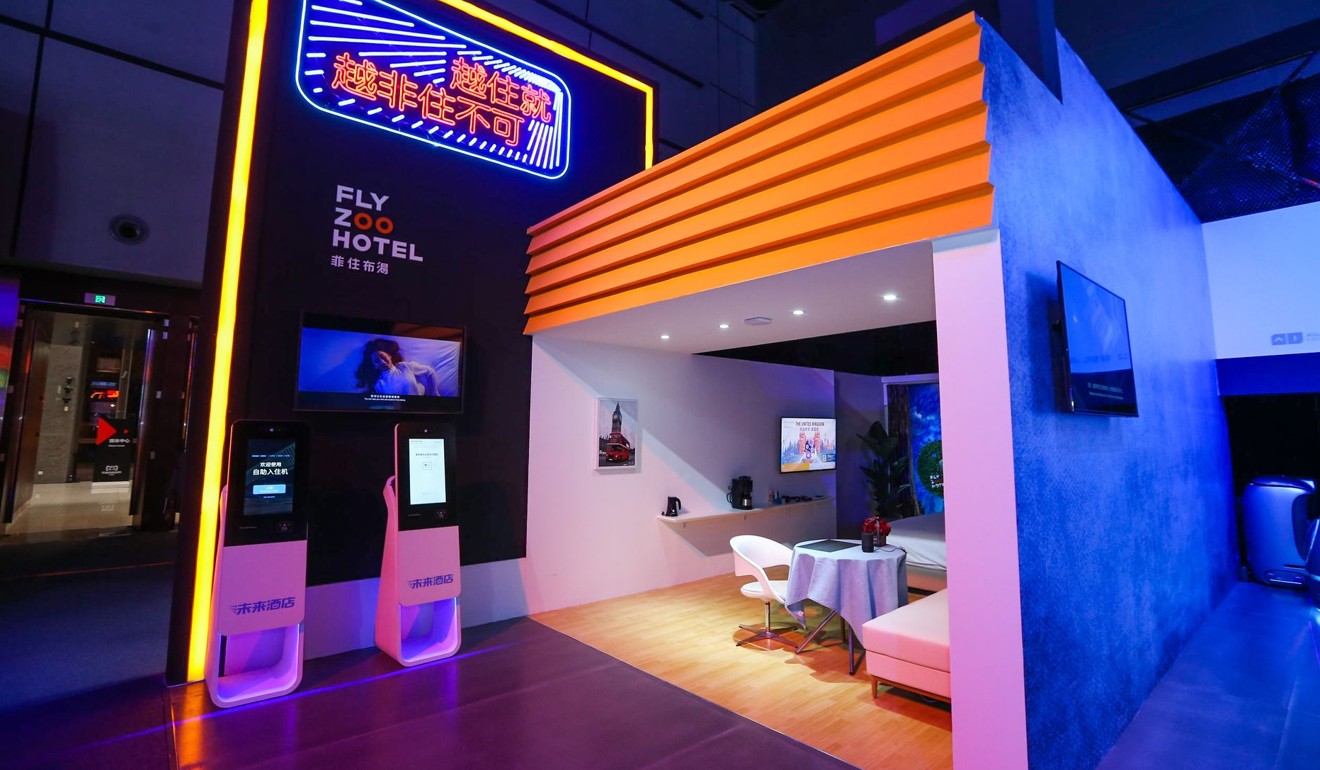 An exhibit shows what a Flyzoo hotel room would look like, equipped with smart appliances and a facial recognition check-in process. Photo: Handout