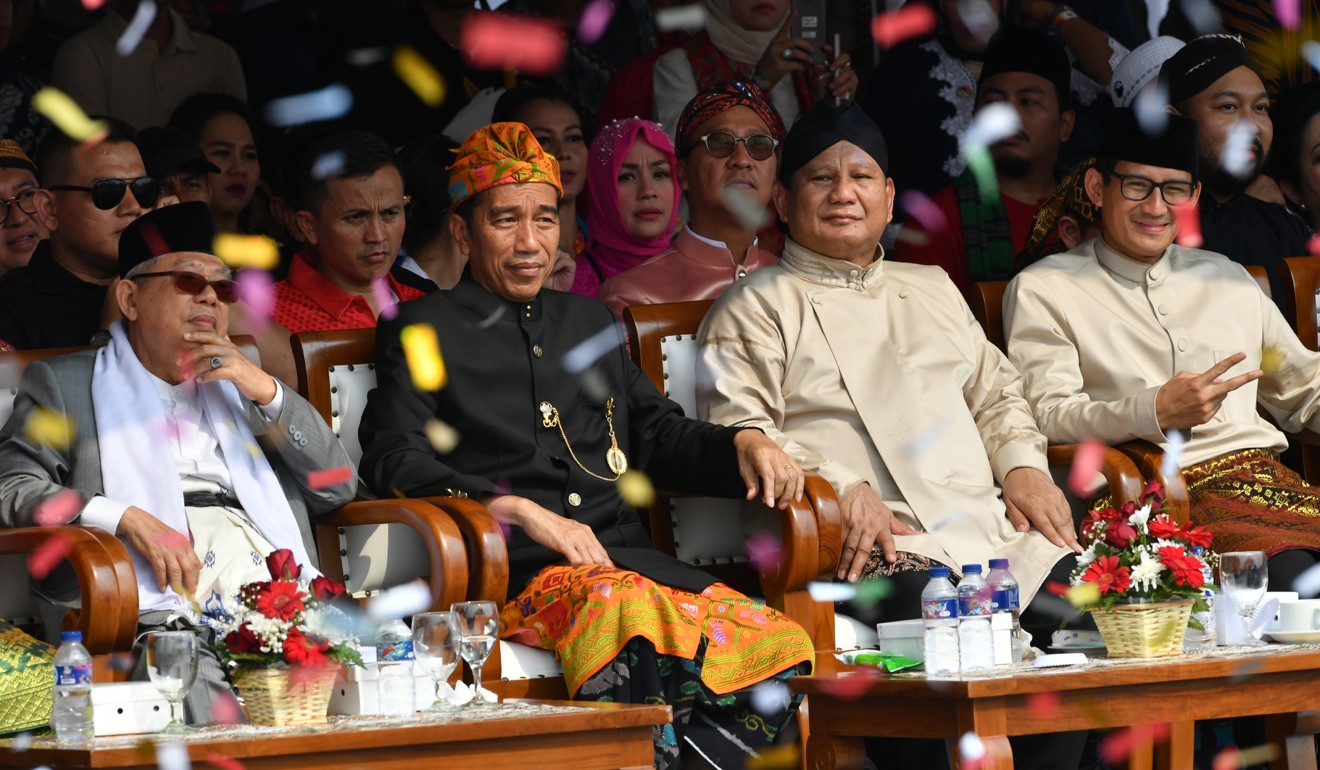 The running mates, from left: Ma’ruf Amin and Joko Widodo sit next to Prabowo Subianto and Sandiaga Uno. Photo: AFP