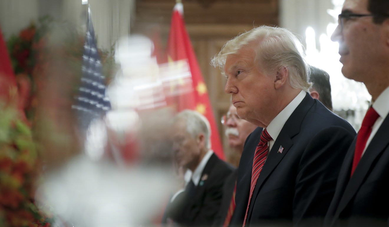 US President Donald Trump listens to China’s Xi Jinping during the dinner. Photo: AP