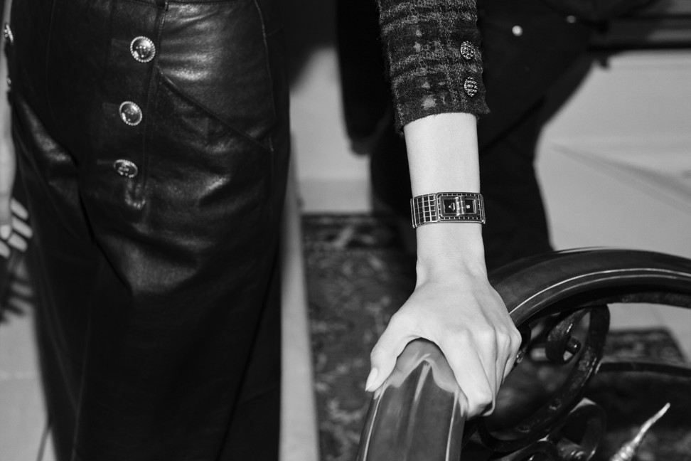 The CODE COCO timepiece by Chanel features a metal bracelet covered with a high-shine black ceramic.