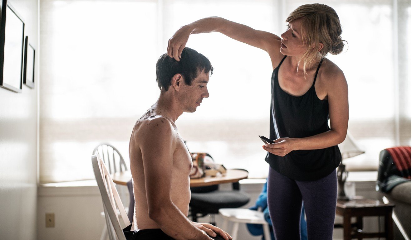 Honnold gets his hair cut by girlfriend Sanni McCandless before attempting his historic climb. Photo: National Geographic/Jimmy Chin