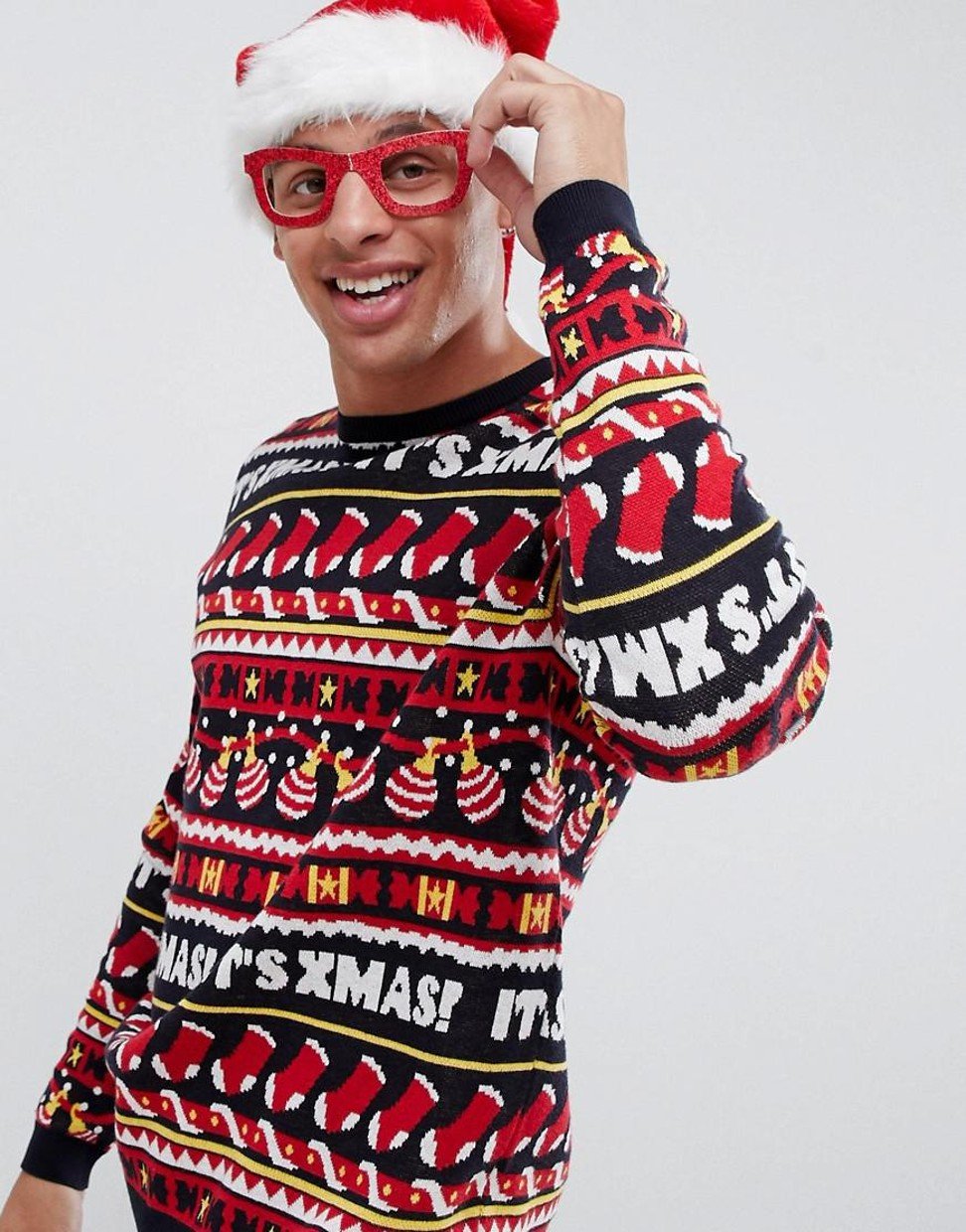 ASOS DESIGN Christmas jumper with all over festive design. Photo: Asos