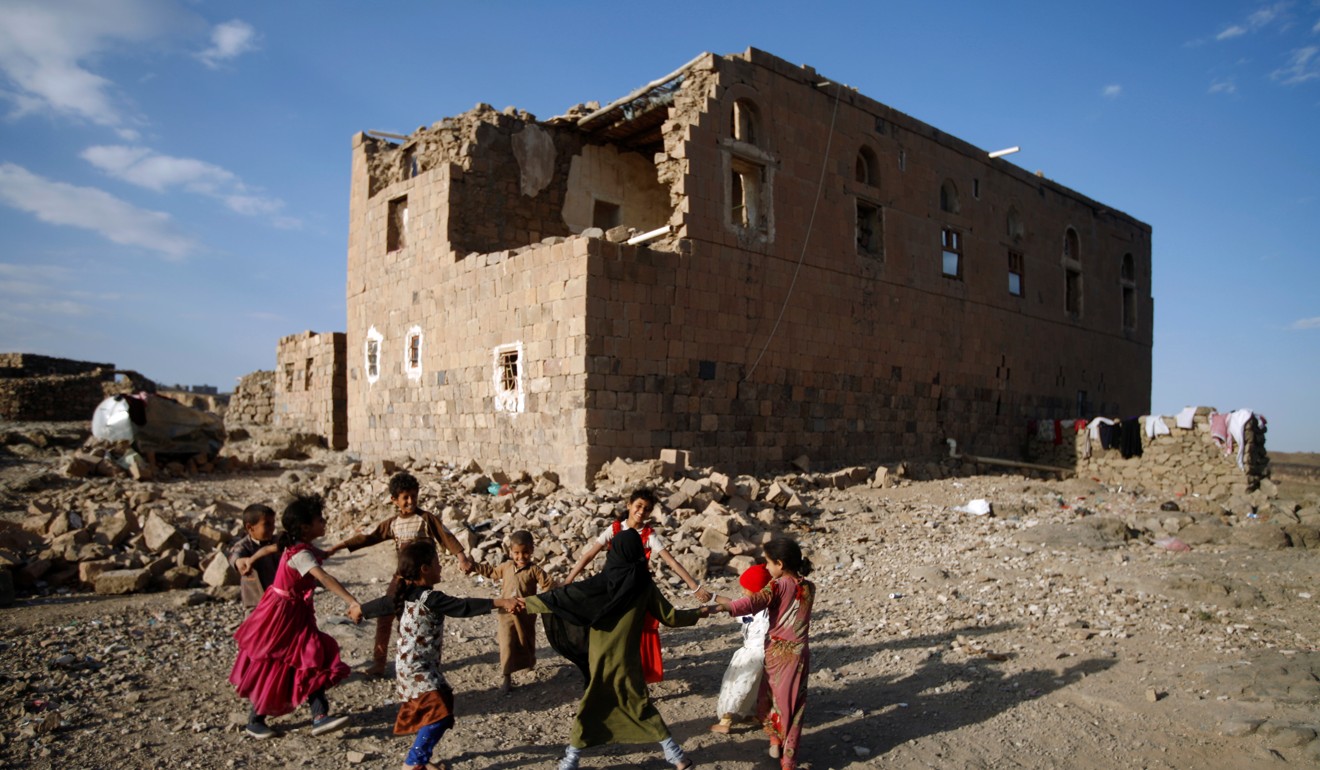 Children play near a house destroyed in air strike carried out by the Saudi-led coalition in Faj Attan village, Sanaa, Yemen, on Thursday. Photo: Reuters