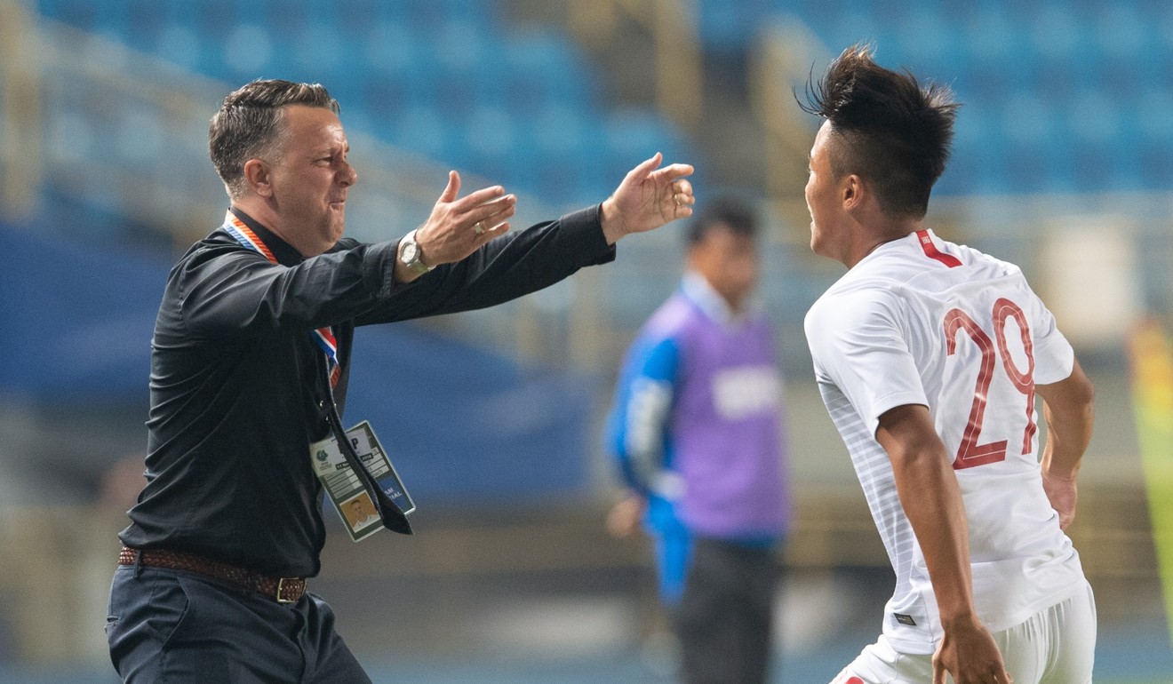 Gary White gets ready to embrace Chung Wai-keung after scoring against Taiwan. Photo: HKFA