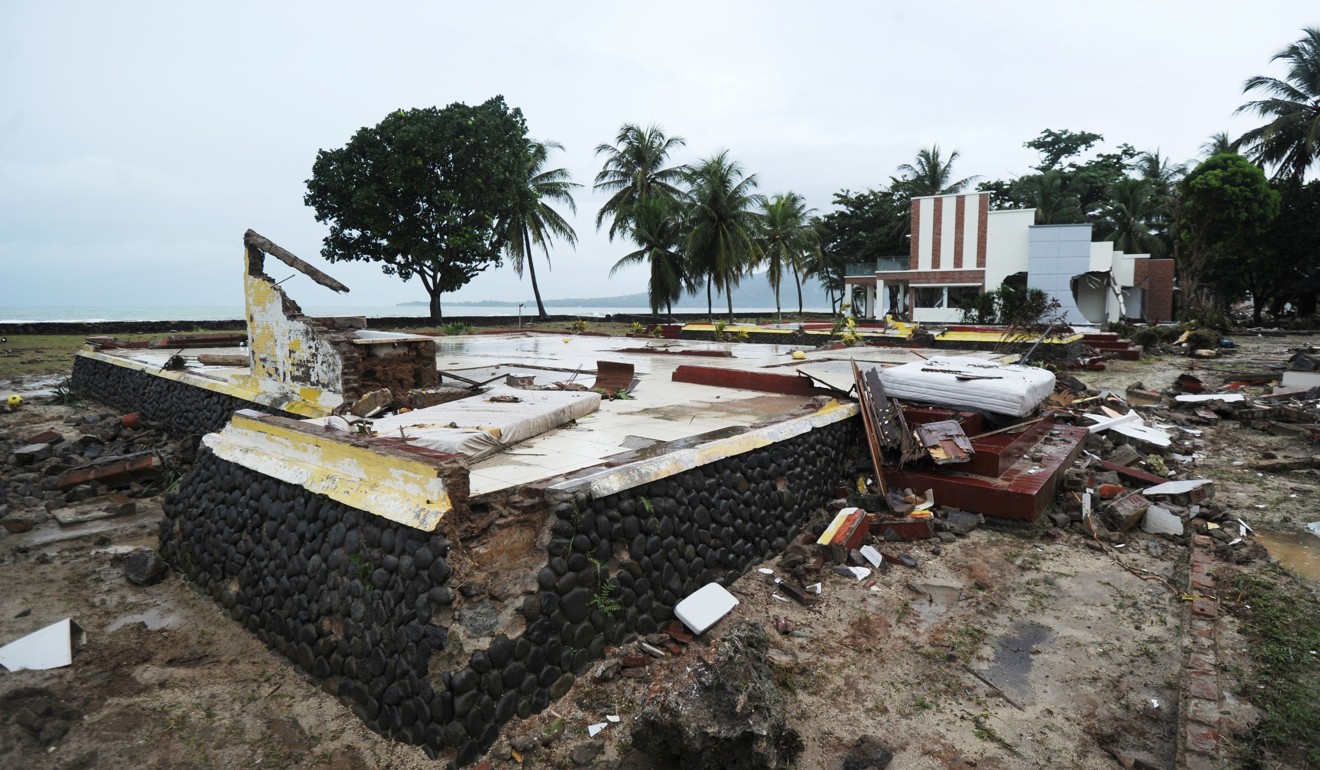 The leftover foundation of a building at the Mutiara Carita Cottages in Carita on December 24. Photo: AFP