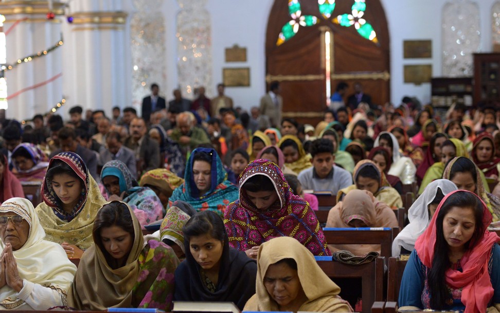 Pakistani Christians attend the Christmas Day service at a church in Peshawar on Tuesday. Photo: AFP