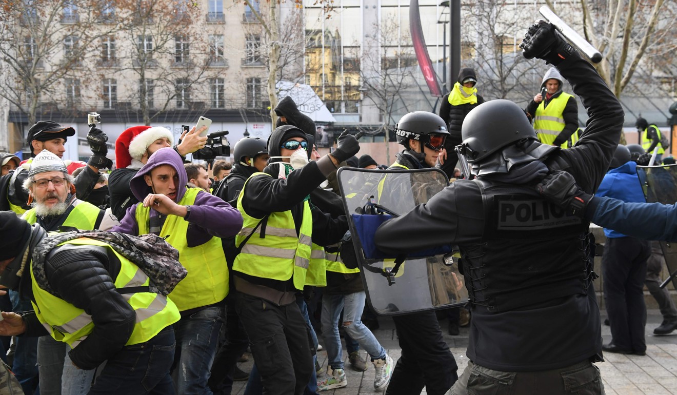 Riot police clash with protesters at a demonstration earlier in December. Photo: AFP