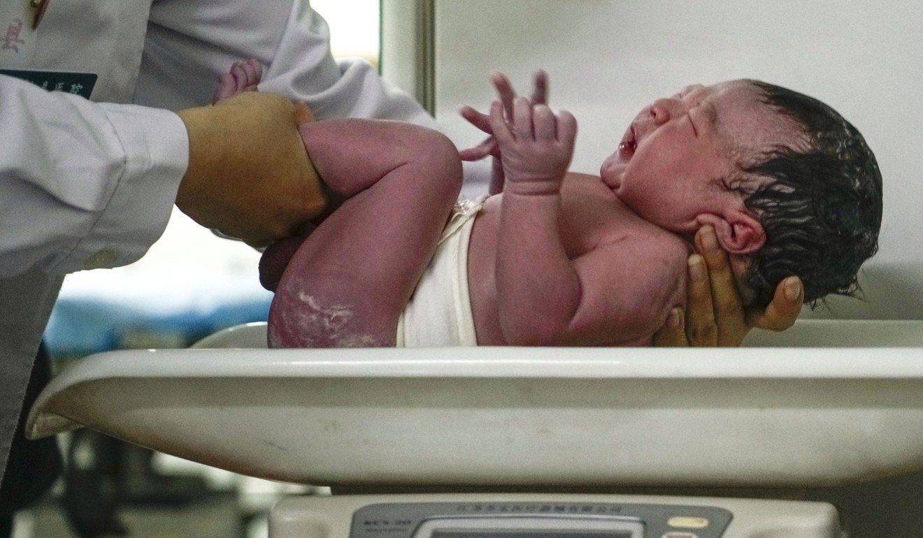 A newborn baby is weighed at the Anxin county hospital in Xiongan New Area of Hebei Province in October 2017. After decades under the one-child policy, China’s two-child policy, implemented in 2016, may be abolished in the near future. Photo: Xinhua