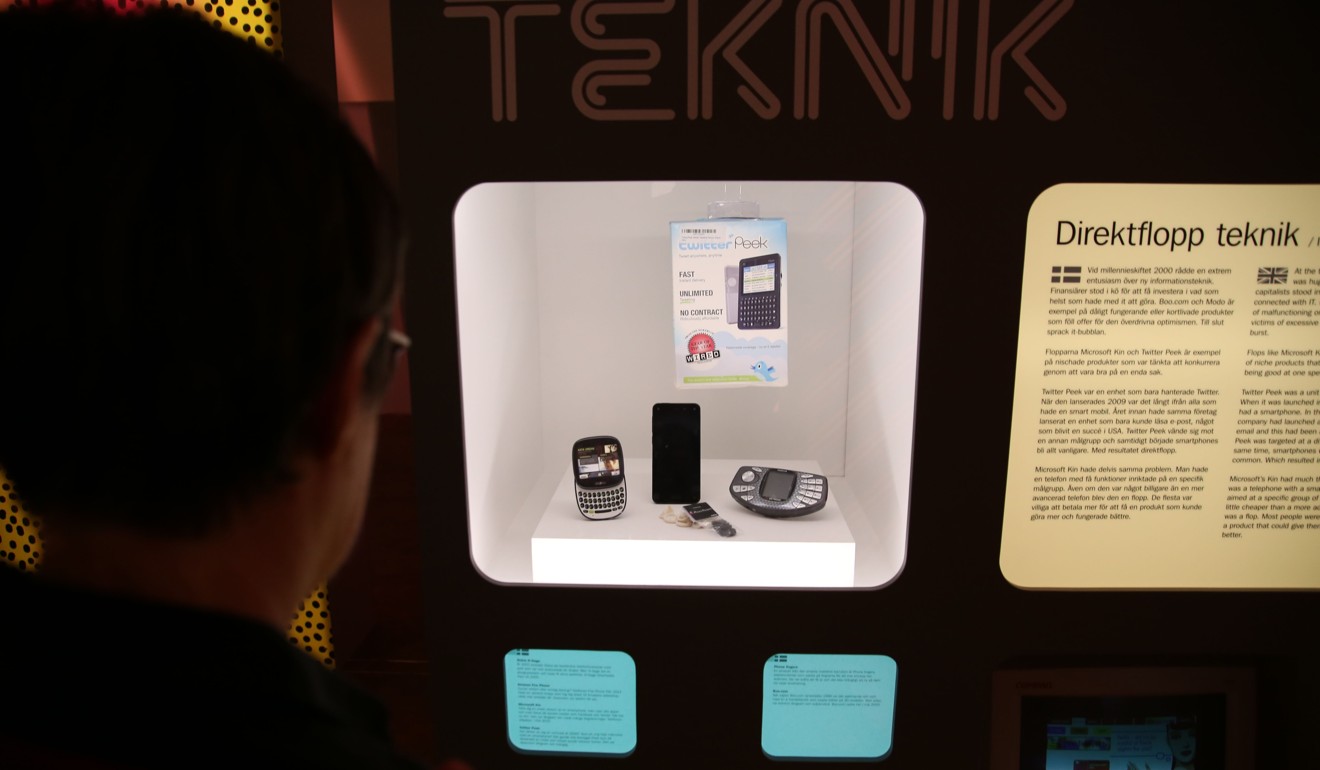 A visitor looks at a display on unsuccessful technological products, including the Twitter Peek, a handheld device that only supporter Twitter, at the Museum of Failure exhibition. Photo: AFP