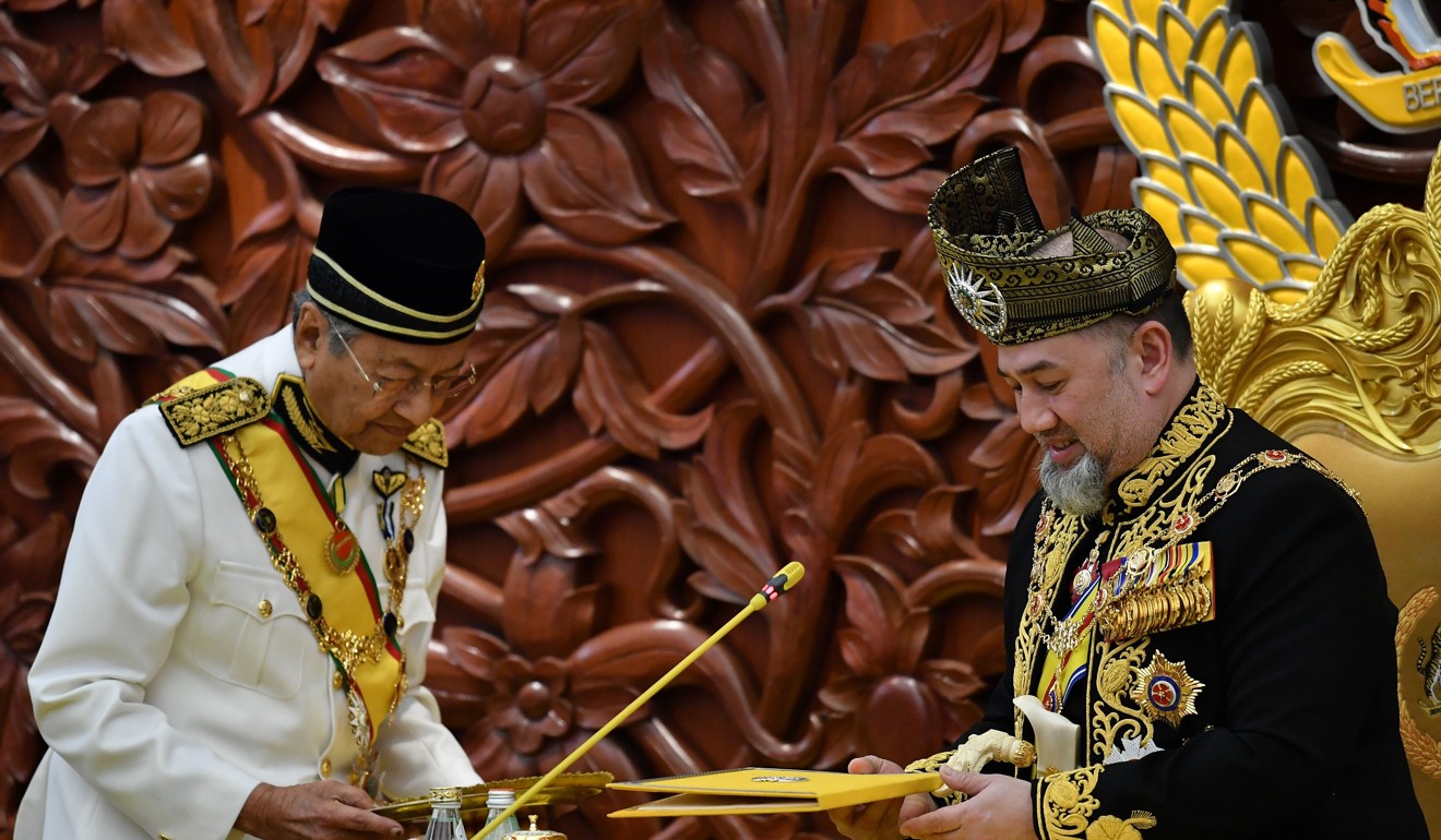Sultan Muhammad V preparing to deliver an address during the opening ceremony of parliament in Kuala Lumpur as Malaysian Prime Minister Mahathir Mohamad looks on. Photo: AFP
