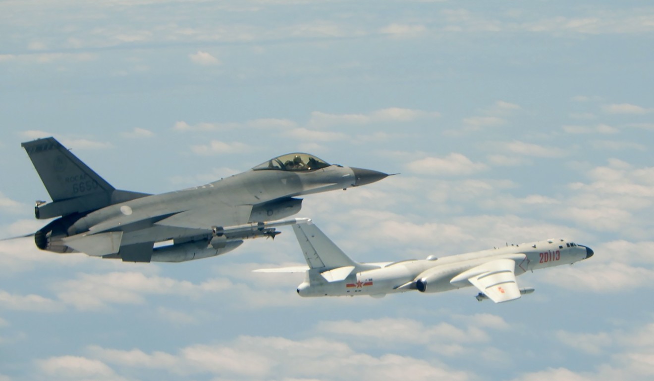 A Taiwan Air Force F-16 fighter aircraft (left) flies alongside a Chinese Air Force H-6K bomber that reportedly flew over the Bashi Channel, south of Taiwan, and over the Miyako Strait, near Japan’s Okinawa Island, in a drill on May 11, 2018. China sent fighter jets and other military aircraft near Taiwan that day in a series of drills which Beijing said were aimed at the island’s “independence forces”. Photo: AFP
