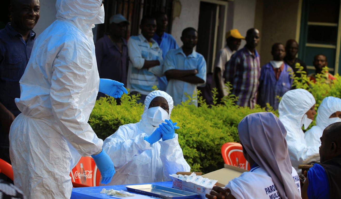 Congolese and WHO officials wear protective suits for a vaccination campaign against the deadly Ebola virus, which is similar to the new bat-borne virus discovered in China. Photo: Reuters