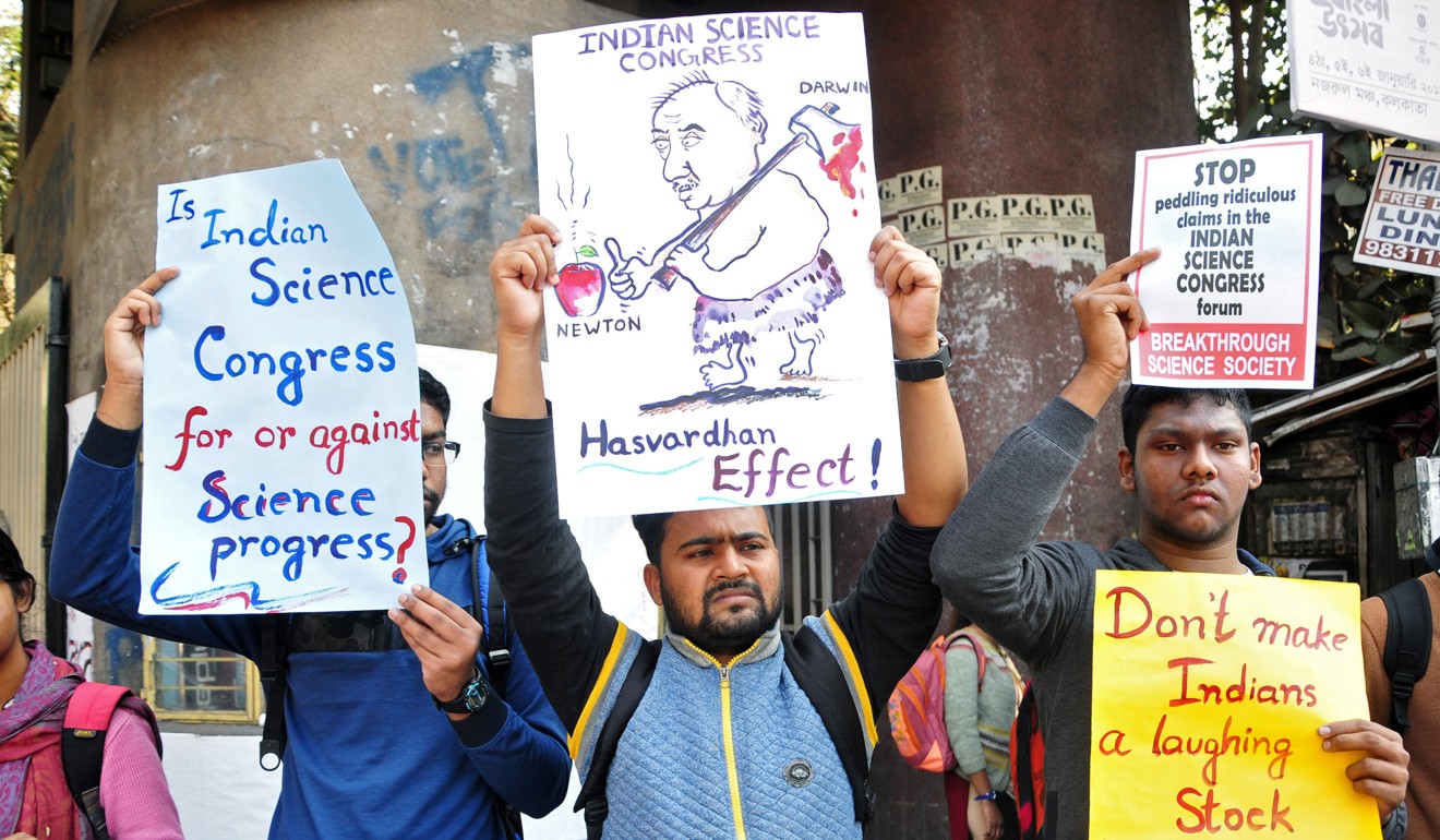 Protesters hold placards denouncing claims made by speakers, including those discrediting theories of Isaac Newton and Albert Einstein, at the 106th Indian Science Congress in Kolkata. Photo: Reuters