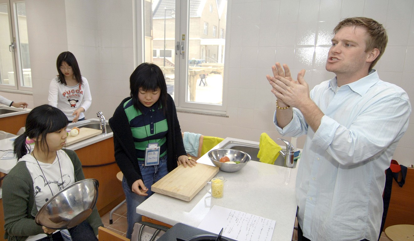 A foreign teacher takes a class in the English Village in Paju, north of Seoul. Photo: AFP