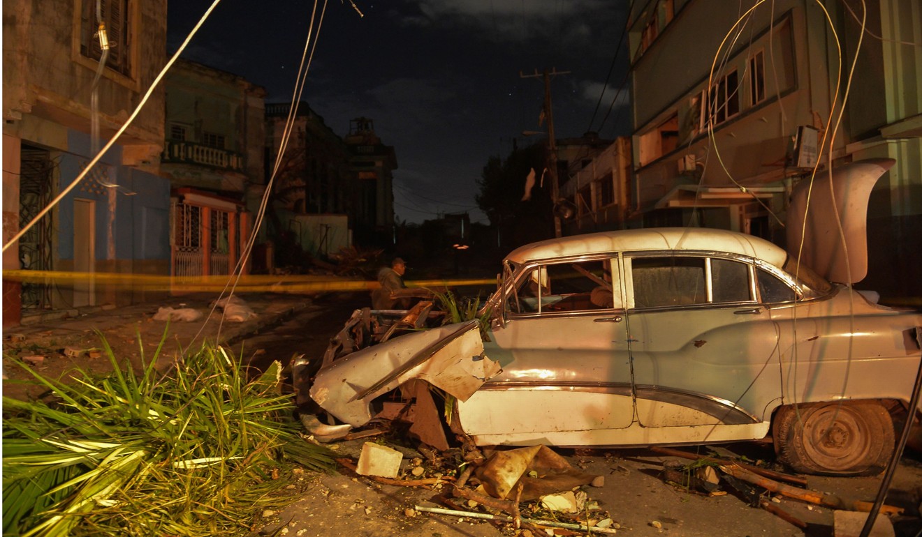 A damaged car is seen in the tornado-hit Luyano neighbourhood in Havana. Photo: AFP