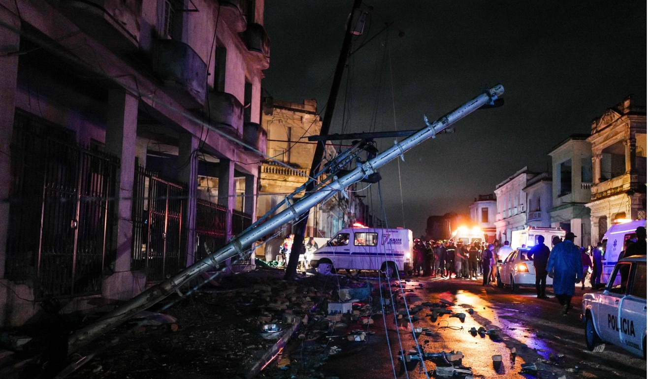 A fallen electrical pole in tornado-hit Luyano neighbourhood in Havana early on Monday. Photo: AFP