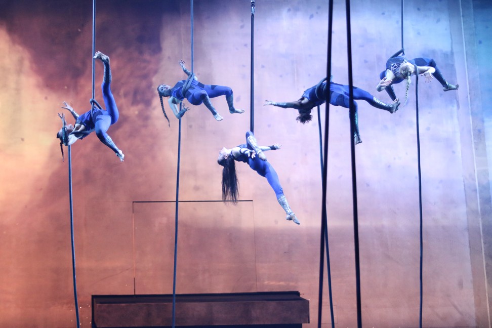 Aerialists are suspended from the ceiling during ‘Elekron’, Studio City’s new stunt show.