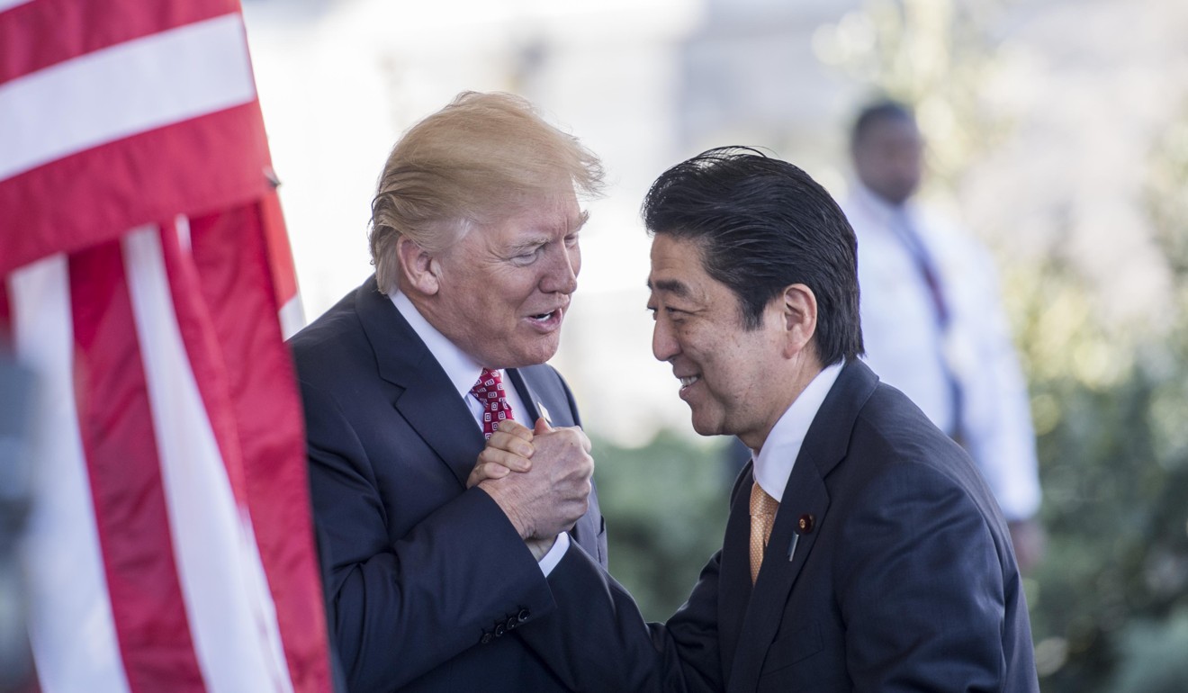 US President Donald Trump greets Japanese Prime Minister Shinzo Abe on his arrival at the White House on February 10, 2017. During their meetings, Trump assured Abe of US support in any conflict over the disputed Diaoyu Islands, known as the Senkaku Islands in Japan, in the East China Sea. Photo: Washington Post
