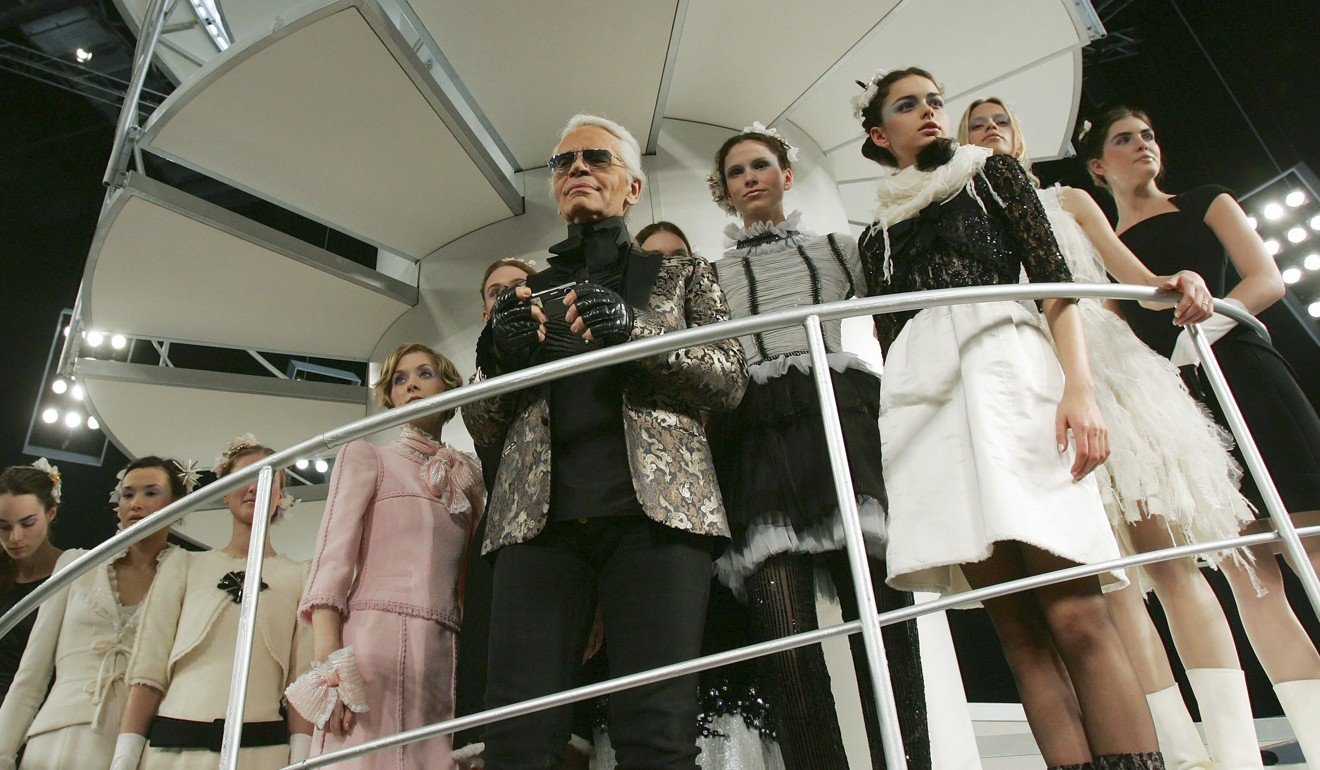 German fashion designer Karl Lagerfeld leads models at the end of a fashion show for Chanel’s Spring-Summer Haute Couture 2006 collection in Hong Kong in March 2006. Photo: Reuters