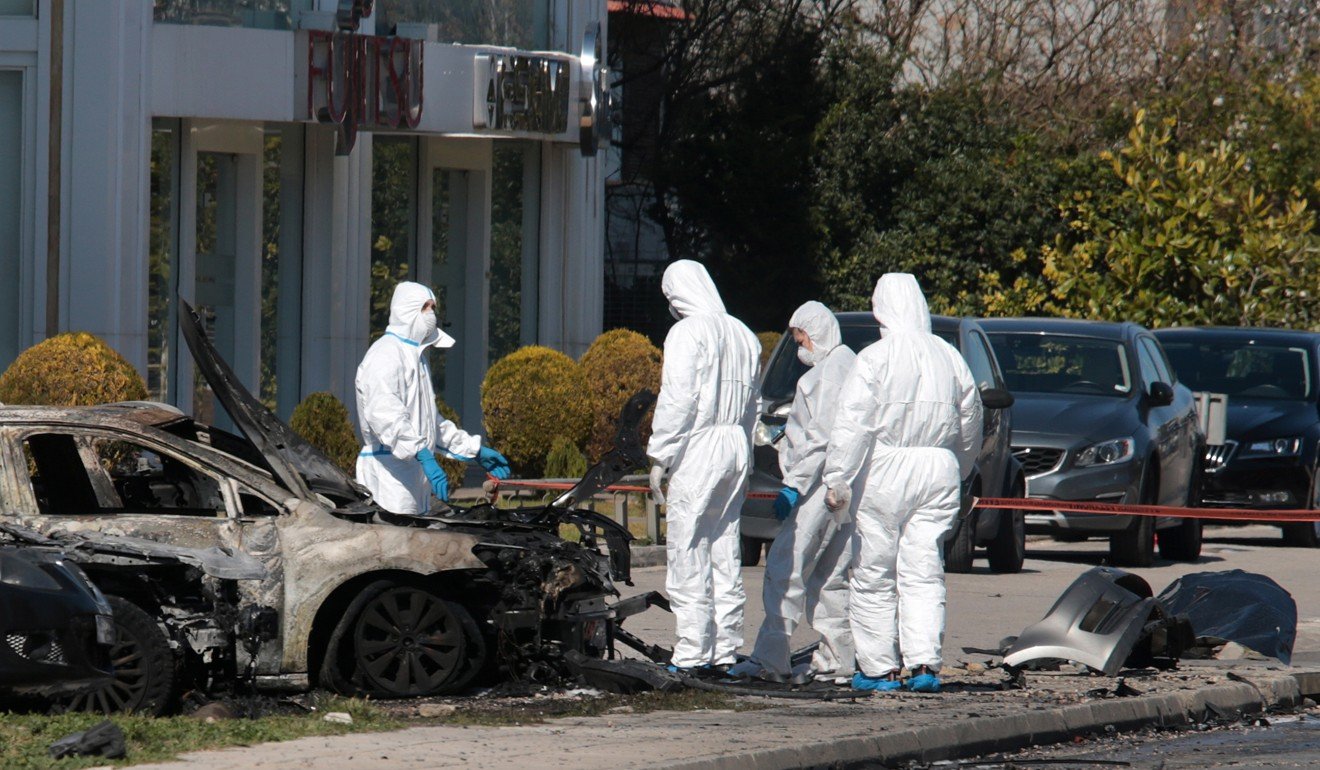 Police experts search for evidence at the site of the explosion. Photo: EPA