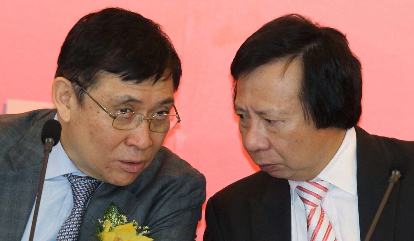 Raymond Kwok (left) and Thomas Kwok, then co-chairmen of Sun Hung Kai Properties, meet the media at the company’s annual general meeting in November 2014. Photo: Edward Wong