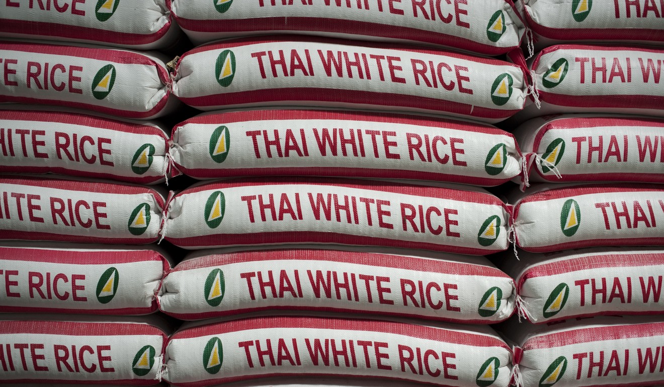Bags of rice stacked in Bangkok. Photo: AFP