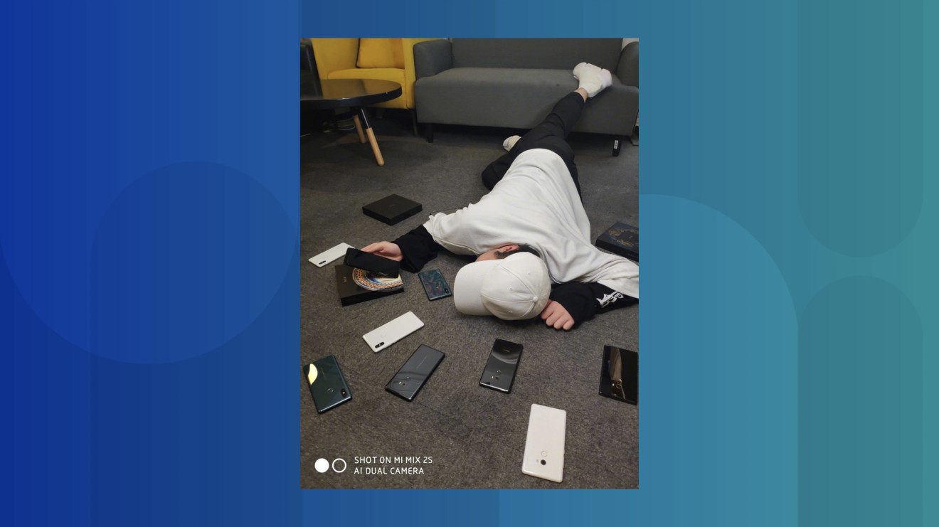 Eagle-eyed netizens spotted that this man is probably holding Xiaomi’s upcoming Mi MIX 3 flagship. (Picture: Xiaomi)