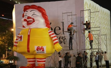 Ron English’s giant MC Supersized figure being removed from outside the Reel Department Store in Shanghai.