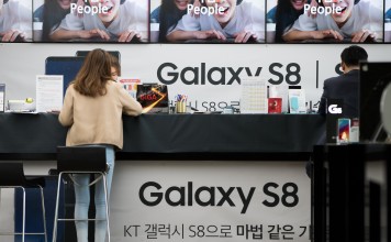 Signage for the Samsung Galaxy S8 smartphone at KT Corp's Olleh Square flagship store in Seoul. Photo: Bloomberg