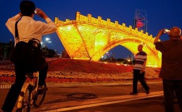 People take pictures of the “Golden Bridge on Silk Road” art installation, set up ahead of the belt and road forum in Beijing this weekend. The forum has an emphasis on mutual discussion, mutual construction and mutual sharing. This is greatly welcomed. Photo: Reuters