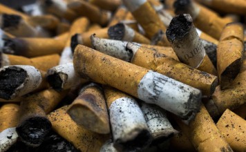 Cigarettes in an ashtray in Centreville, Virginia. A government study showed that 1 in 5 US adults use tobacco. Photo: Agence France-Presse