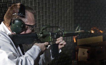 In this January 11, 2018 photo, Washington Rick Wyant, supervisor of the forensic firearms unit at the Washington state Patrol crime laboratory in Seattle, test fires a semi-automatic rifle that has been fitted with a so-called bump stock device to make it fire faster. Photo: AP