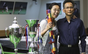 Ng On-yee with her father Ng Yam-shui and her trophies. Photo: Xiaomei Chen