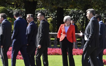Heads of government walk past British Prime Minister Theresa May after a photo at an informal European Union summit in Salzburg, Austria, on September 20. Photo: AP