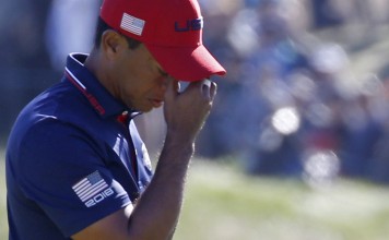 Tiger Woods cannot stop Jon Rahm in the Ryder Cup singles. Photo: Reuters