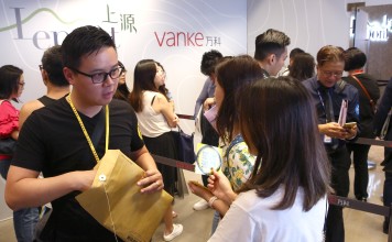 Prospective investors queue up for Vanke Property (Hong Kong)’s Le Pont project in Tuen Mun, where 347 flats were on sale, on Sunday. Photo: Edmond So
